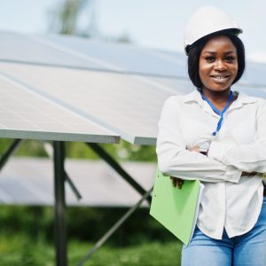 African american technician check the maintenance of the solar panels. Black woman engineer at solar station.